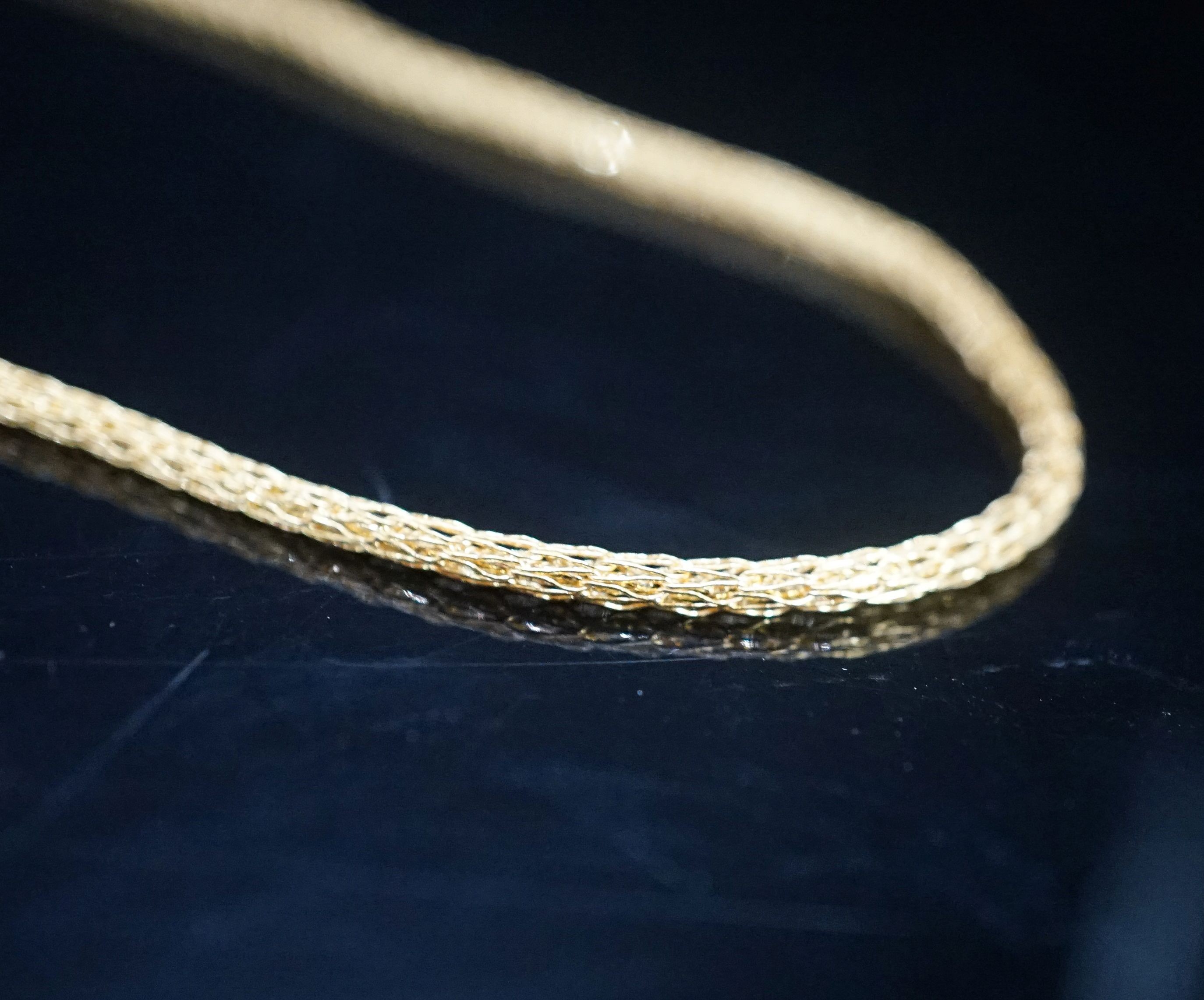 A continental yellow metal necklace, 38cm, 7.7 grams.